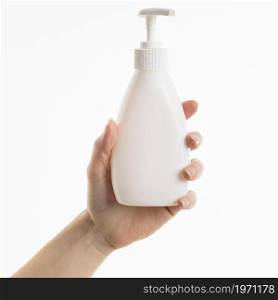 hand holding liquid soap bottle. High resolution photo. hand holding liquid soap bottle. High quality photo