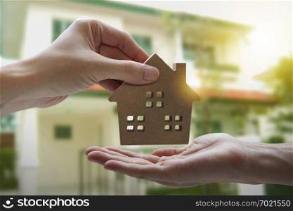 Hand holding model house , Mortgage loan property for concept