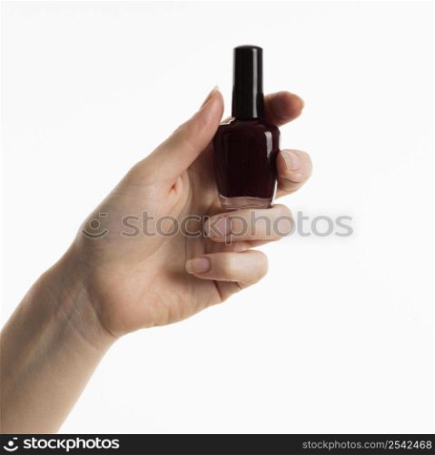 hand holding nail polish