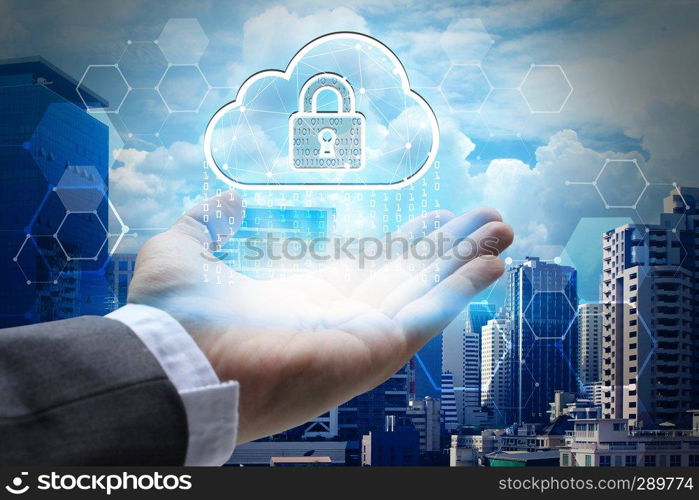 hand holding network using Currencies sign symbol interface of padlock over the Network connection of cityscape background.