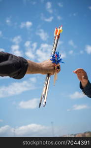 Hand holding old style wooden arrows