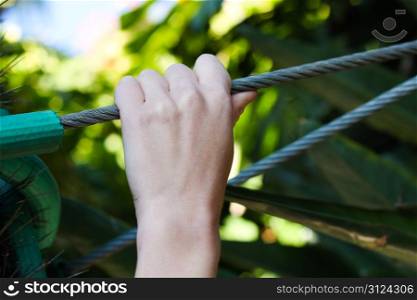 Hand holding onto a Wire rope in full strength