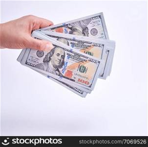 hand holding paper money on a white background, close up