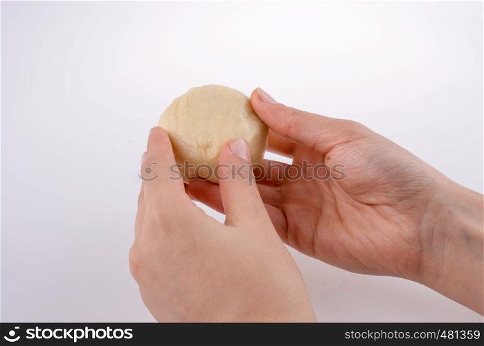 Hand holding paste on a white background