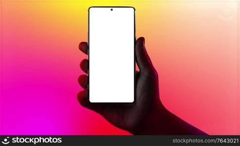Hand holding phone. Silhouette of male hand holding smartphone isolated on multicolored background. Bezel-less screen. Cinemagraph. Hand holding phone.