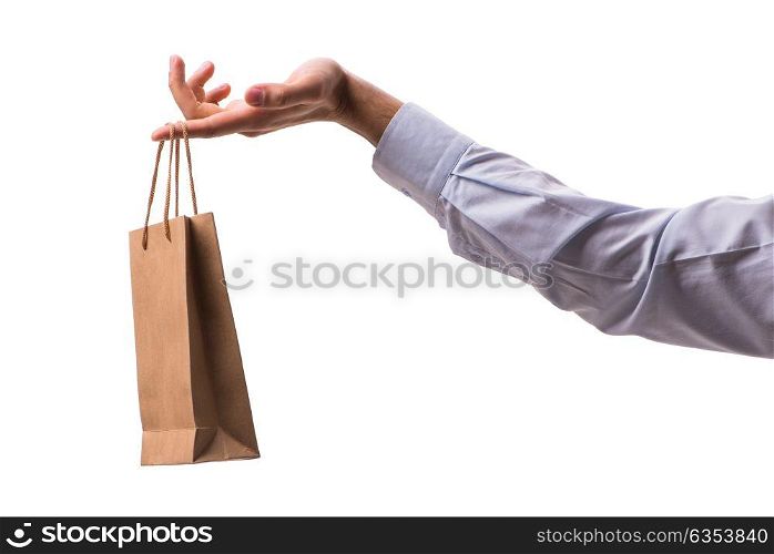 Hand holding shopping bags with christmas shopping on white background. Hand holding shopping bags with christmas shopping on white back