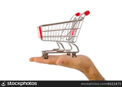 Hand holding shopping cart on white