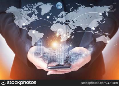Hand holding smartphone with worldwide network connection technology icon. Network connection concept. Global network business concept. World map element of this image furnished by NASA.