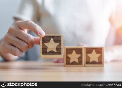 hand holding Star block. Customer choose rating for user reviews. Quality, Service rating, ranking, customer review, satisfaction, evaluation and feedback concept