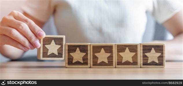 hand holding Star block. Customer choose rating for user reviews. Quality, Service rating, ranking, customer review, satisfaction, evaluation and feedback concept