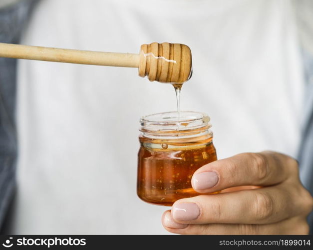 hand holding sweet honey jar. Resolution and high quality beautiful photo. hand holding sweet honey jar. High quality beautiful photo concept