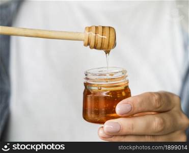 hand holding sweet honey jar. Resolution and high quality beautiful photo. hand holding sweet honey jar. High quality beautiful photo concept