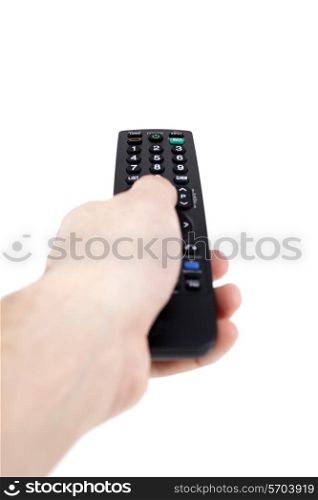 Hand holding television remote Isolated over white background .