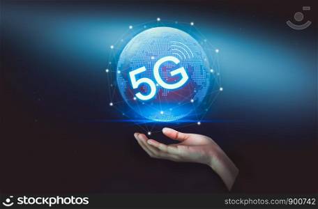 Hand holding the 5G hologram, wireless systems and internet of thing in future and standard of modern signal transmission. Concept networking technology