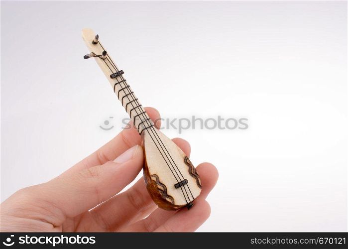 Hand holding the classic turkish instrument Saz