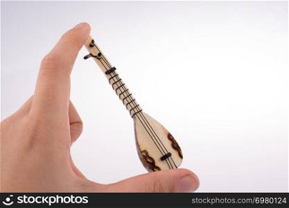 Hand holding the classic turkish instrument Saz
