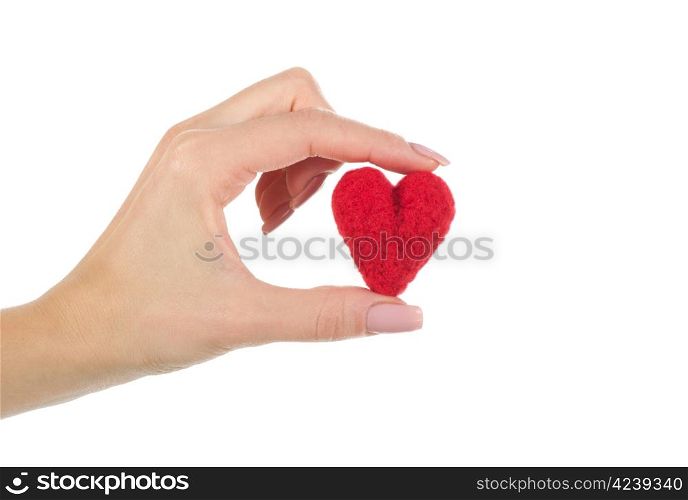 Hand holding the heart isolated on white background