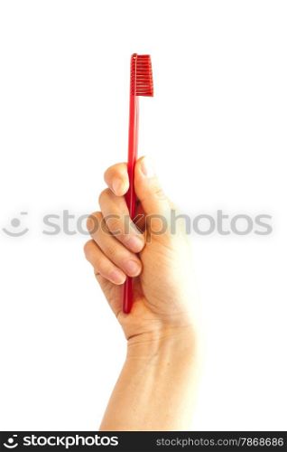 hand holding toothbrush