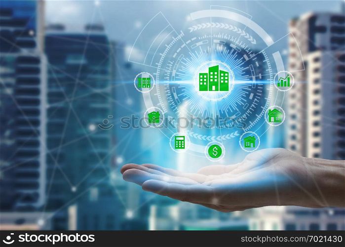 Hand holding with property investment icons over the Network connection on property background, Property investment concept.