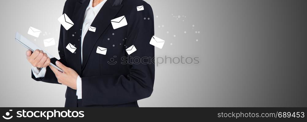 Hand holding woman check and sending message with email in a phone on grey background, banner communication concept.