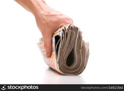 hand holds a bundle of newspapers isolated on a white background