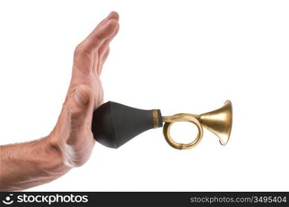 hand holds an old car horn isolated on a white background