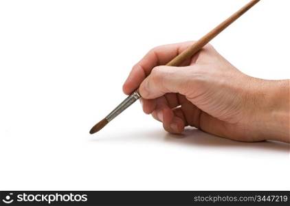 hand holds the brush to draw isolated on white