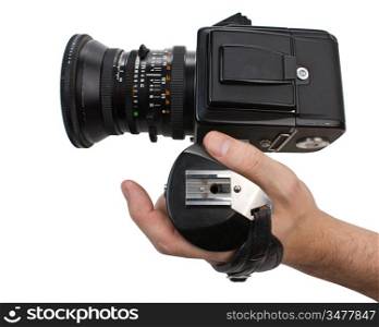 hand holds the handle of the camera isolated on white background