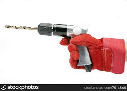 hand in a working glove holds reversible air drill