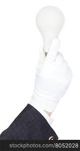 hand in business suit and textile glove holds incandescent light bulb isolated on white background