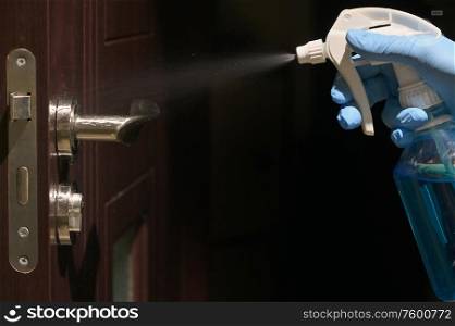 Hand In Protective Glove Cleaning Inside Door Handle