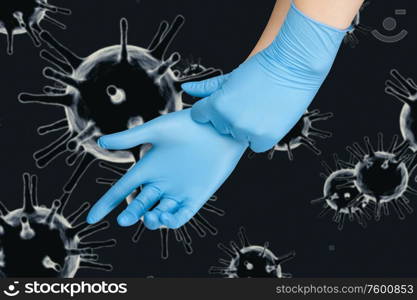 Hand in protective gloves on corona virus COVID-2019 background.. Hand in protective gloves