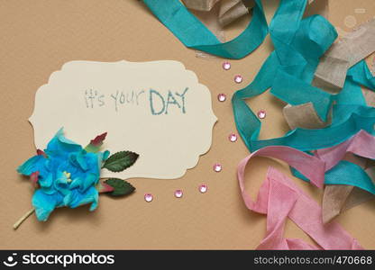 hand made scrapbooking post card and tools lying on a table