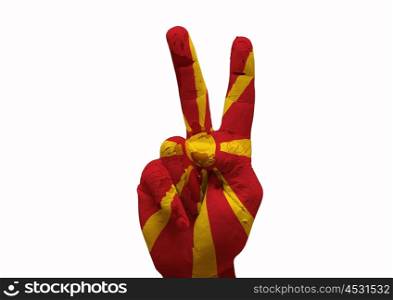 Hand making the V sign country flag painted macedonia