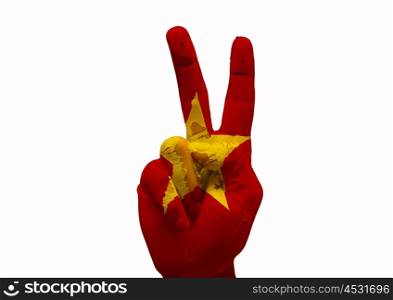 Hand making the V sign country flag painted vietnam