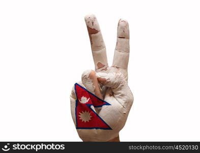 Hand making the V sign nepal country flag painted