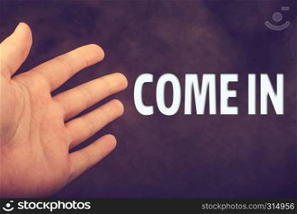 Hand making welcome gesture saying come in