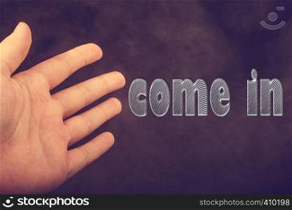 Hand making welcome gesture saying come in