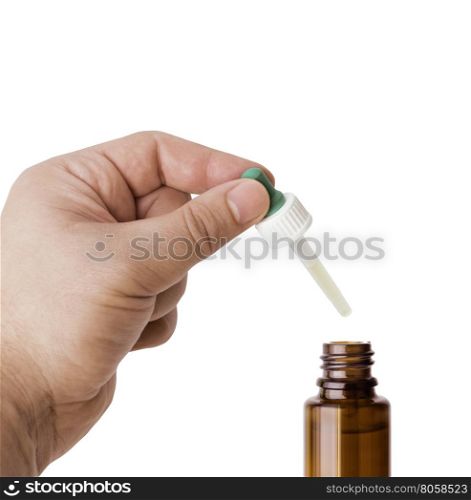 Hand man (scientist, doctor) keeps the pipette for drop over the container with liquid, medication or chemical substance laboratory. Isolated on white background with clipping path