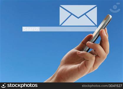 Hand of a businessman holding a smartphone and have white envelo. Hand of a businessman holding a smartphone and have white envelope of e-mail symbol on blue background for design in your work.