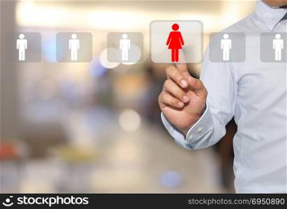 hand of a man touching red women icon on modern button pressing in concept officer looking a people for employee,business technology on blur interior background.