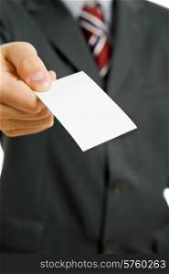 Hand of business man offering business card