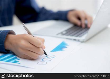 Hand of business man pointing document data graph and chart with pen, marketing and investment, report of statistics profit for financial, economic and growth of finance, management and planning.