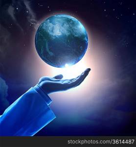 Hand of businessman holding earth planet against illustration background