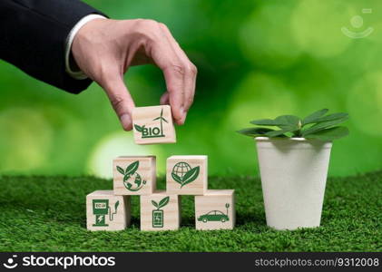 Hand of businessman holding Earth, symbolizing green business utilizing biofuel technology and environmental conservation for sustainable eco-friendly energy for clean future. Alter. Green business utilizing biofuel technology and eco conservation. Alter