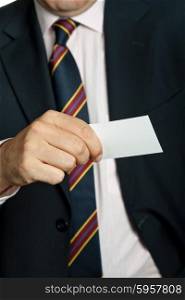 hand of businessman offering businesscard, close up