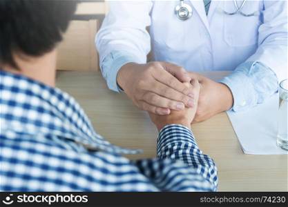 Hand of doctor reassuring his patient
