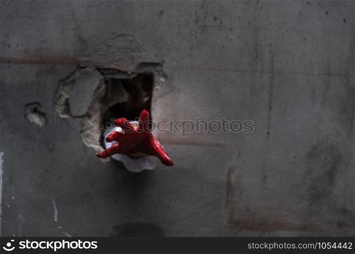 Hand of Ghost woman or Zombie Penetrate wall ,halloween concept