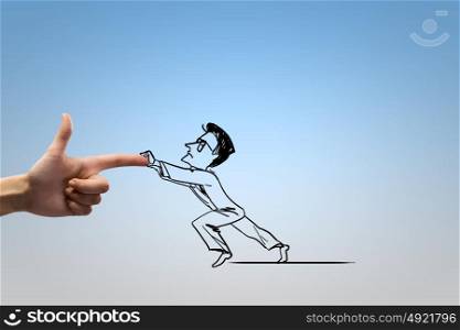 Hand of justice. Close up of human hand attacking businessman caricature