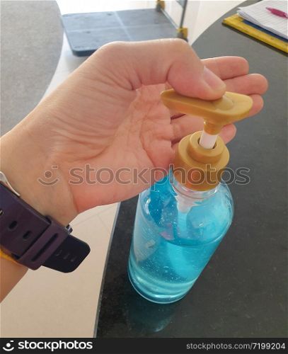 Hand of people applying alcohol spray or anti bacteria spray to prevent spread of germs, bacteria and virus.Wuhan coronavirus (COVID-19) outbreak prevention,personal hygiene concept.